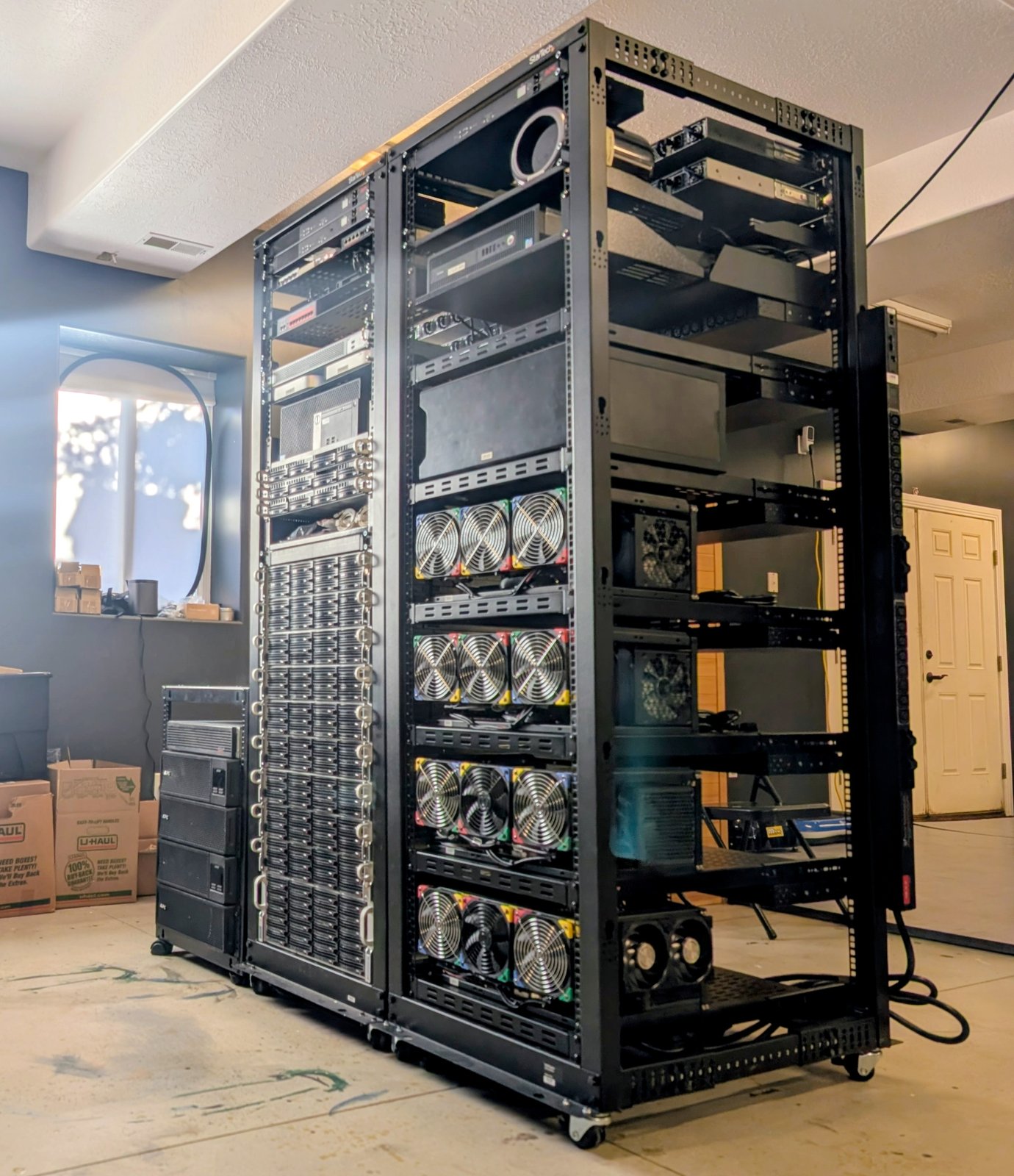 Node0: two 42U racks holding 51 machines, racked and wired in a basement in Eden, Utah